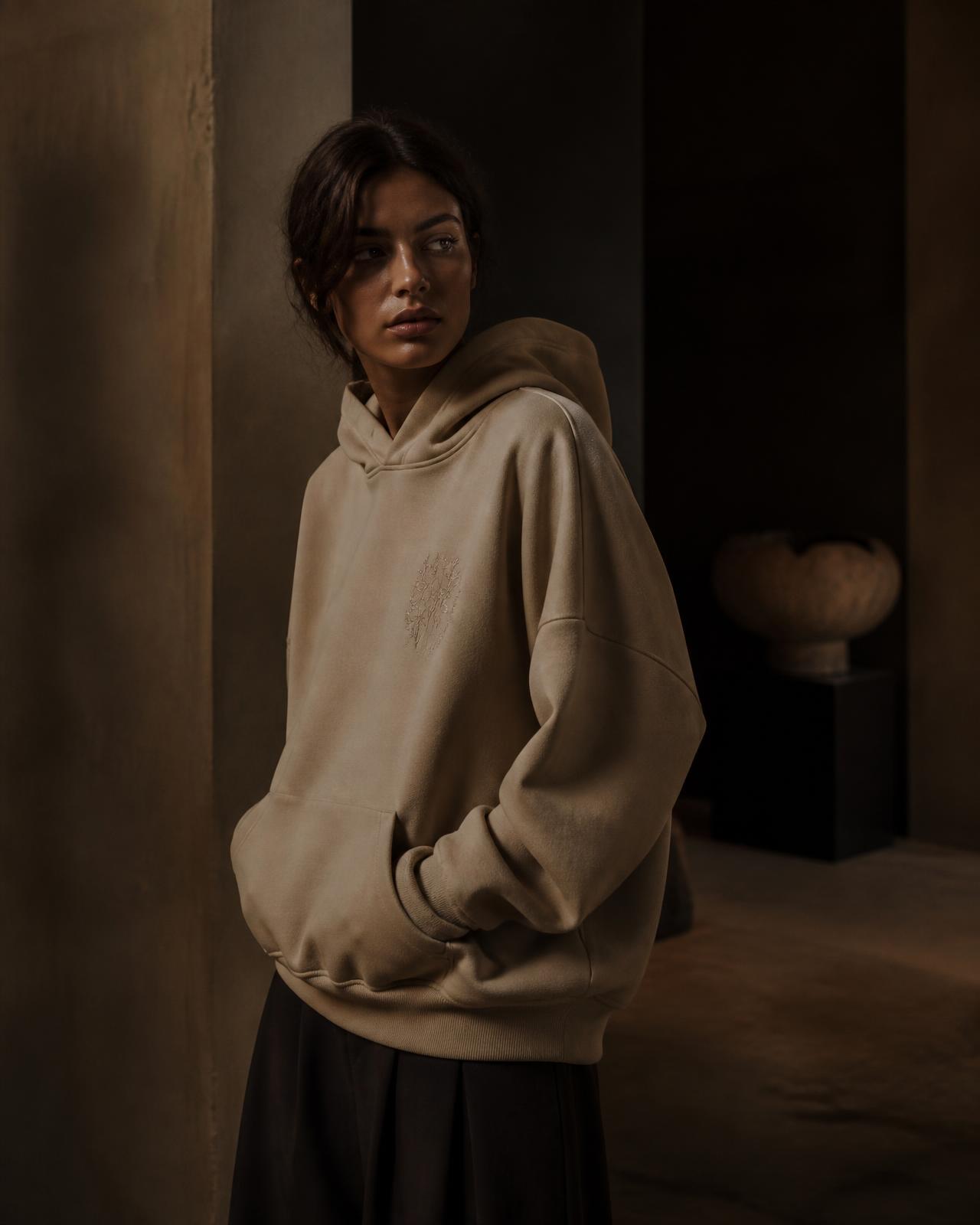 Model wearing a hand-embroidered DAY SIX hoodie