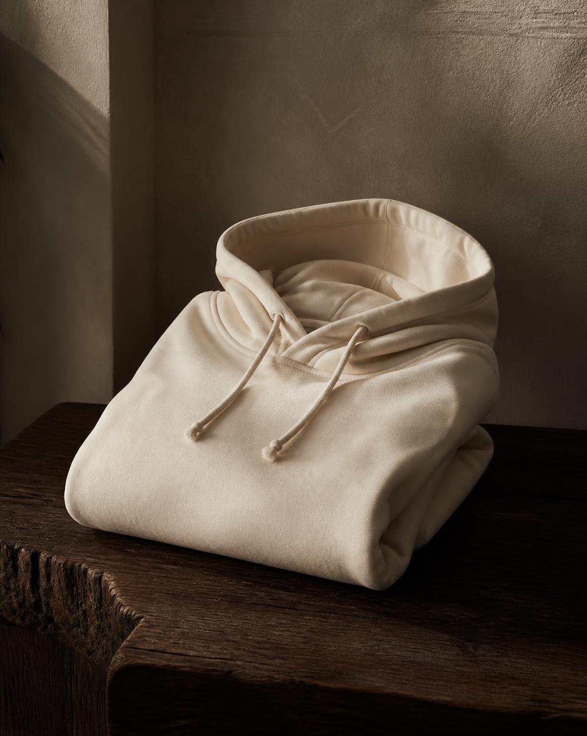 DAY SIX hoodie in warm ivory on dark wood